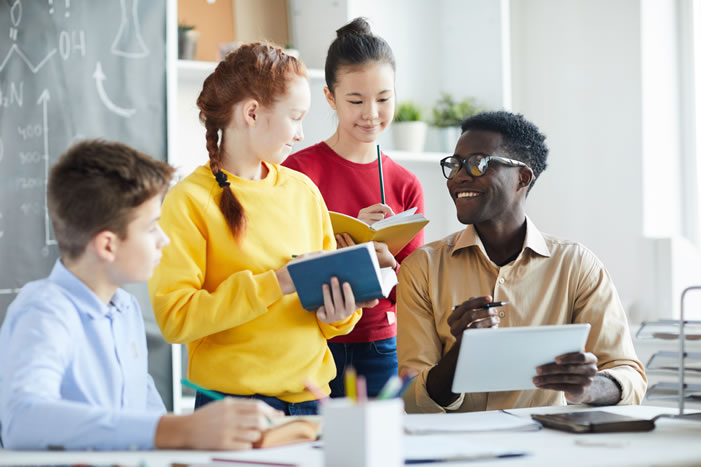 Teacher with students in classroom