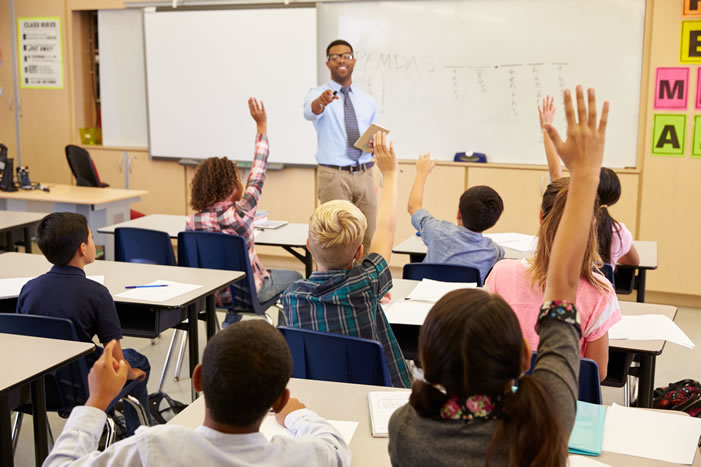 Teacher with students in classroom