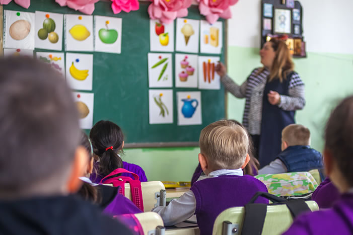 Teacher with students in classroom